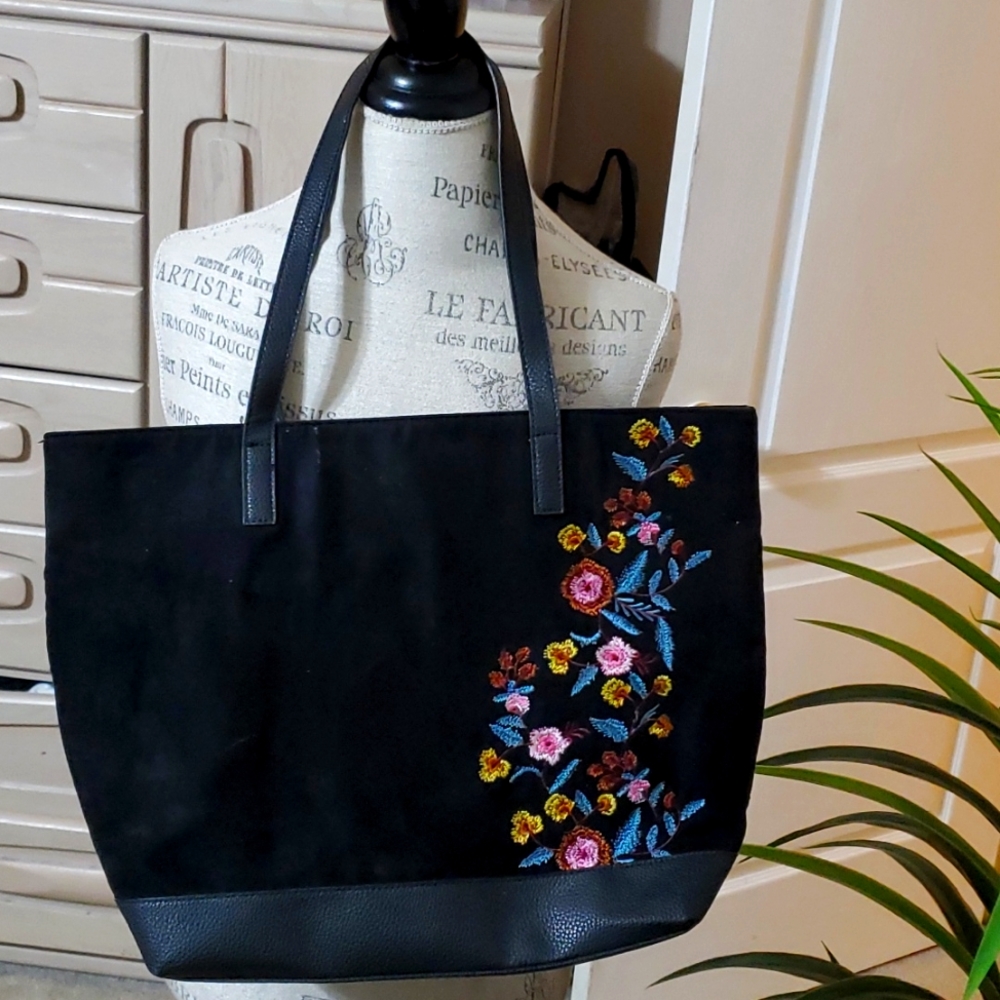 Like sude and like leather very large black bag with flowers on it. $31 Now $27.